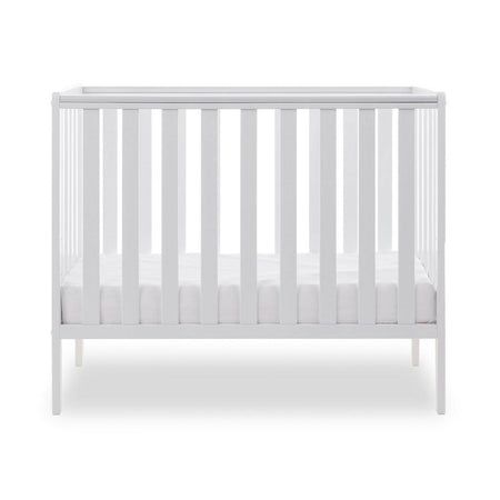 Obaby Bantam Space Saver Cot (White) - side view, shown with mattress base at its lowest level