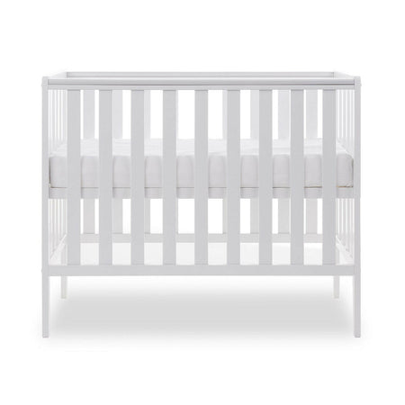 Obaby Bantam Space Saver Cot (White) - sidew view, shown with the mattress base at its highest level