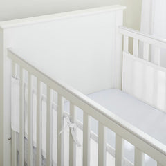 Breathable Baby Mesh Liner - 2 Sided (White) - showing the panels fitted to a cot using the hook`n`loop fastenings and tie straps