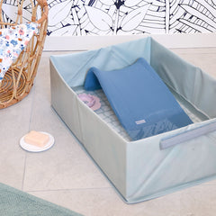 BEABA Camélé’O Pop Up Baby Bath & Transatdor Bundle (Green/Blue) - lifestyle image, showing the bath with the support seat