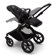 Bugaboo Fox 2 (Black/Black) - quarter view, illustrating the seat in both parent-facing and forward-facing positions