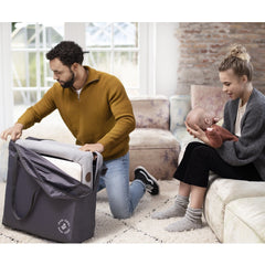 Maxi-Cosi Iris Travel Cot (Essential Graphite) - lifestyle image, showing the cot within its handy storage bag