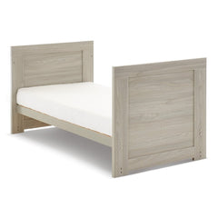 Obaby Nika Cot Bed (Grey Wash) - quarter view, shown here as the toddler bed (mattress not included, available separately)