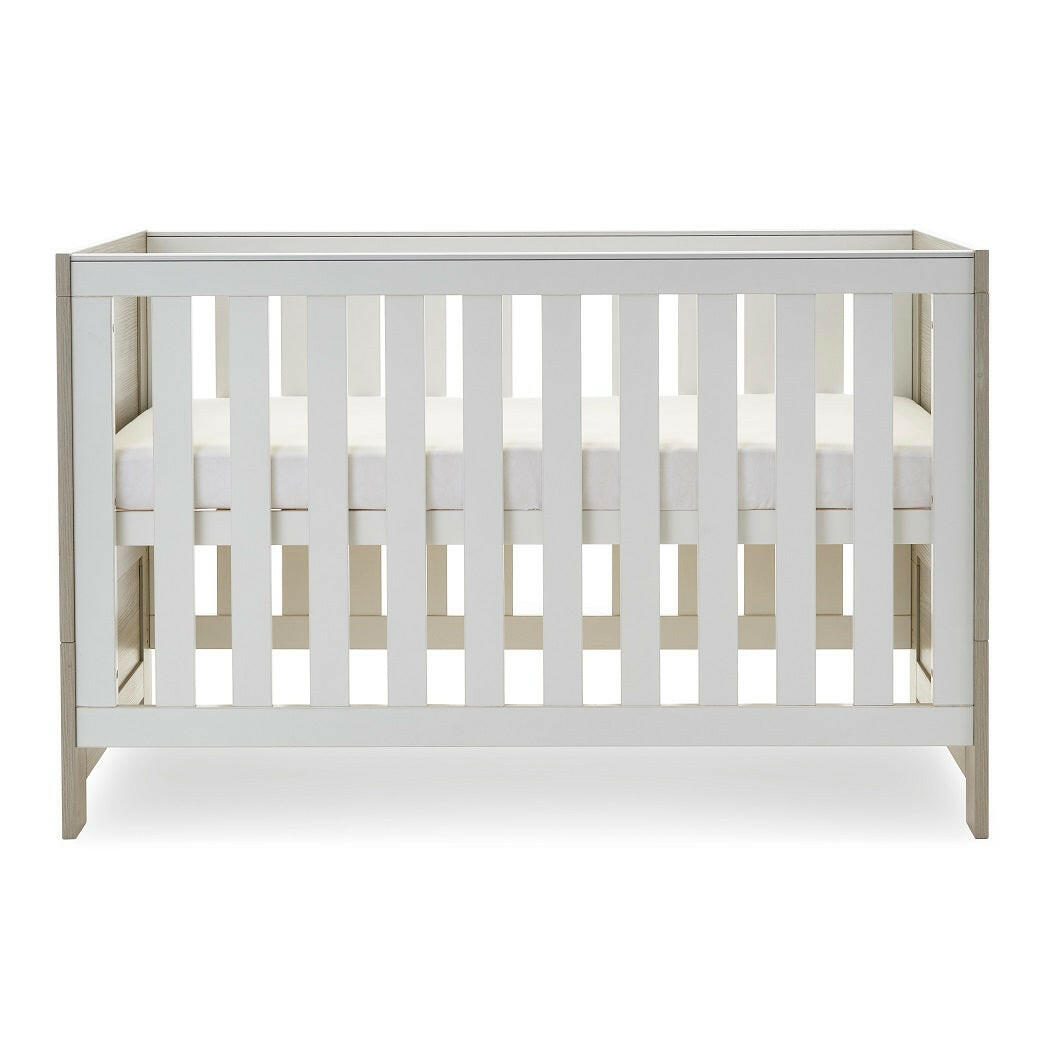 Obaby Nika Cot Bed - Grey Wash & White - side view, with mattress base at its highest level