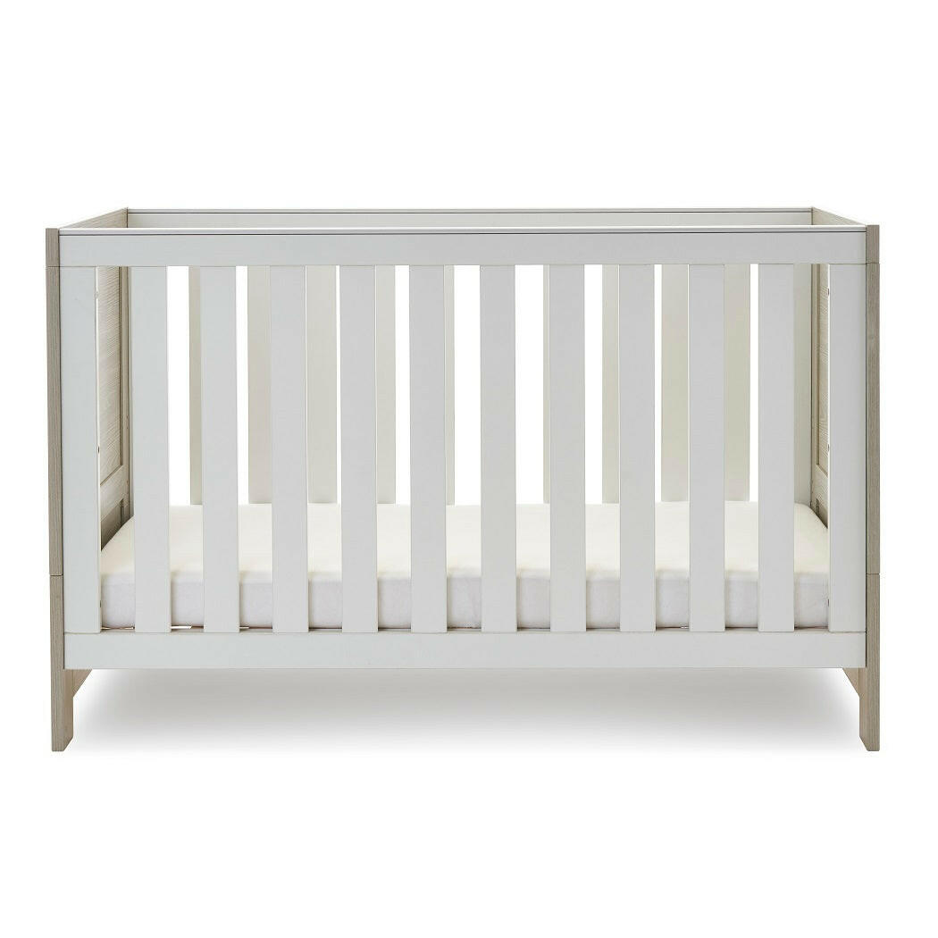 Obaby Nika Cot Bed - Grey Wash & White - side view, with mattress base at its lowest level