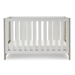 Obaby Nika Cot Bed (Grey Wash & White) - side view, shown here with the cot`s mattress base at its lowest level (mattress not included, available separately)