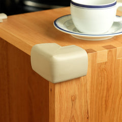 Clevamama Corner Cushions (Pack of 4) - lifestyle image, showing a cushion fixed to the corner of a table