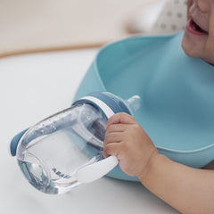 BEABA Silicone Bibs - Pack of 2 (Light Mist/Old Blue) - lifestyle image (bottle not included)