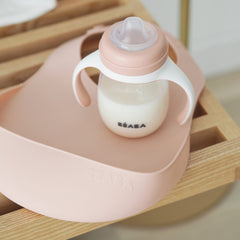 BEABA Silicone Bibs - Pack of 2 (Light Mist/Old Pink) - lifestyle image (bottle not included)