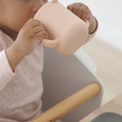 BEABA Silicone Meal Set & Bibs Bundle (Grey/Pink) - lifestyle image, showing the double handled cup