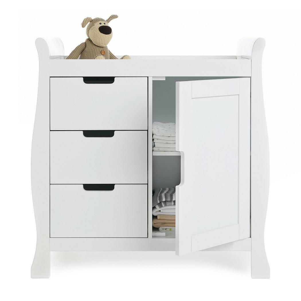 Obaby Stamford MINI Sleigh 2 Piece Room Set (White) - showing the closed changing unit with door open to reveal internal shelves (bedding and toys not included)