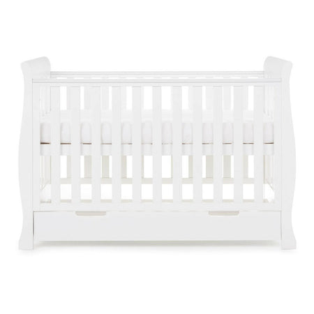 Obaby Stamford Mini Sleigh Cot Bed with Drawer (White) - side view, shown here with the mattress base at its highest level (mattress not included)