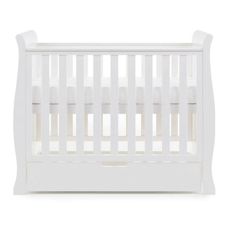 Obaby Stamford Space Saver Cot (White) - side view, shown here with mattress base at its highest level (mattress not included, available separately)