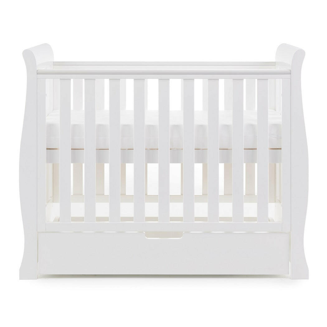 Obaby Stamford Space Saver Cot With SPRUNG Mattress (White) - side view, shown here with mattress at its highest level