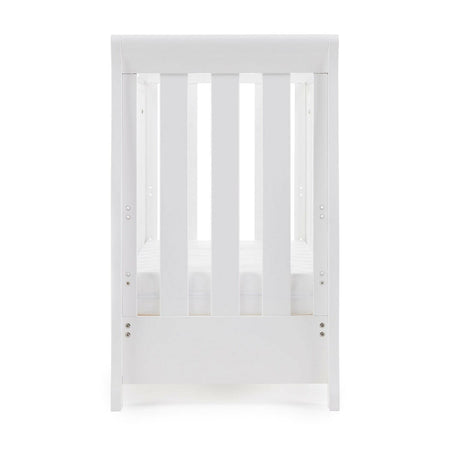 Obaby Stamford Space Saver Cot (White) - end view, shown here with mattress base at its lowest level