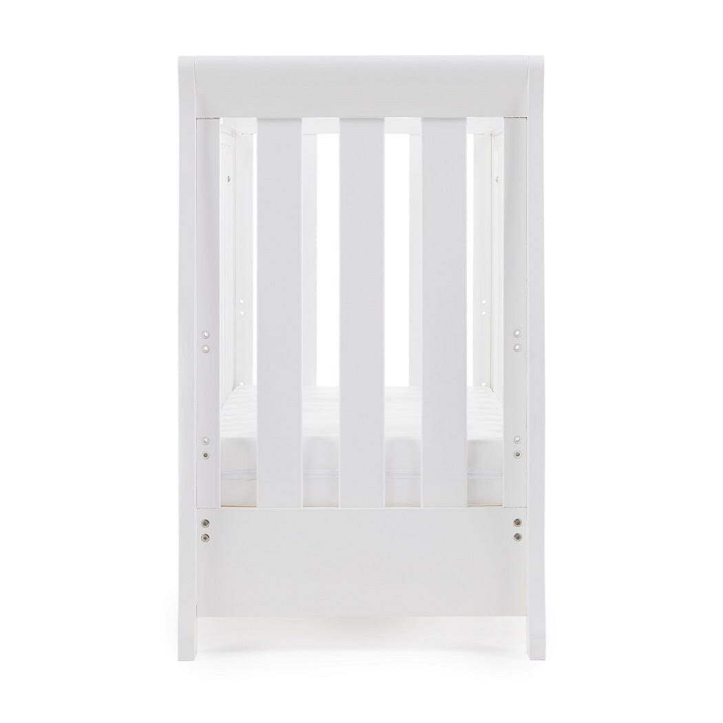 Obaby Stamford Space Saver Cot with FOAM Mattress (White) - end view, shown with mattress base at its lowest level