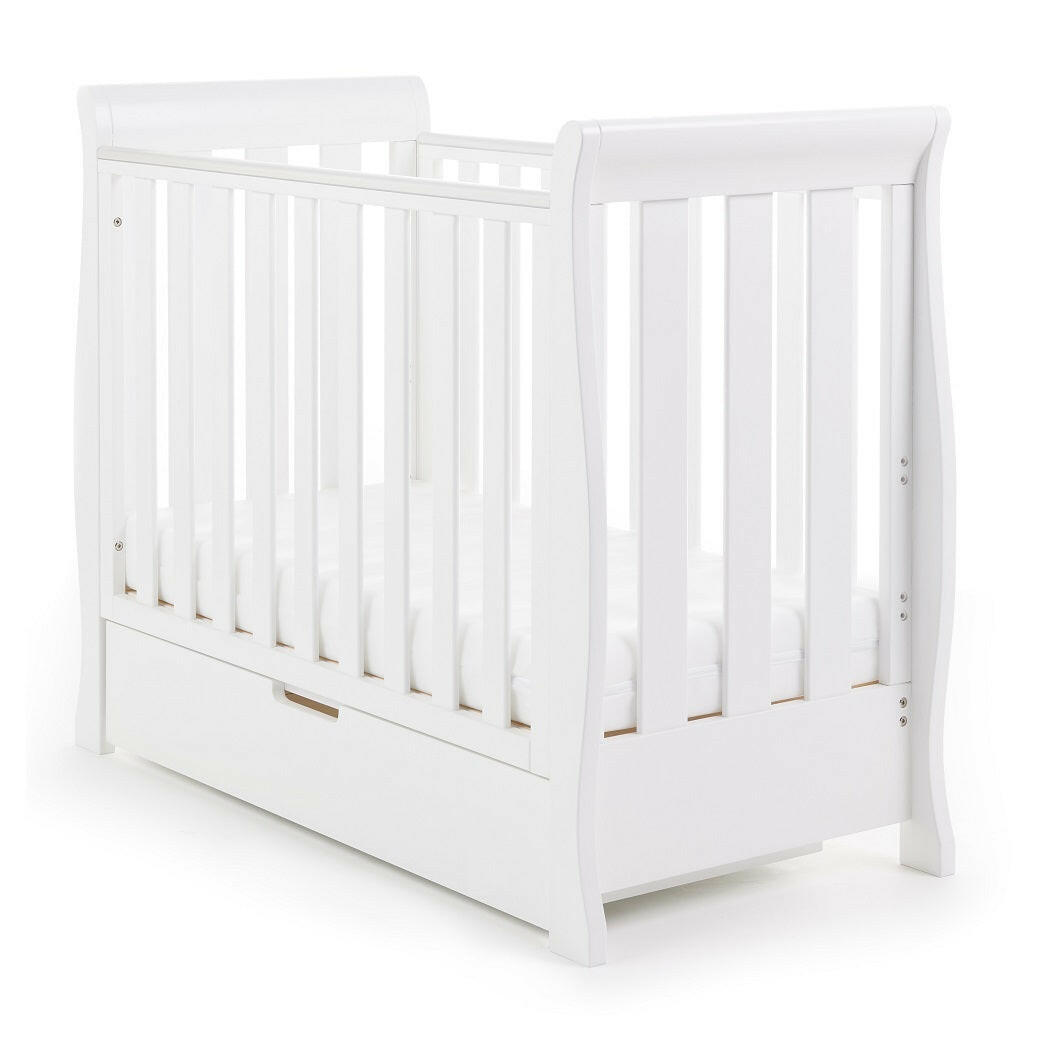 Obaby Stamford Space Saver Cot With SPRUNG Mattress (White) - quarter view, shown here with mattress at its lowest level