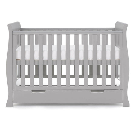 Obaby Stamford Mini Sleigh Cot Bed with SPRUNG Mattress (Warm Grey) - side view, showing the cot with the mattress base at its highest level