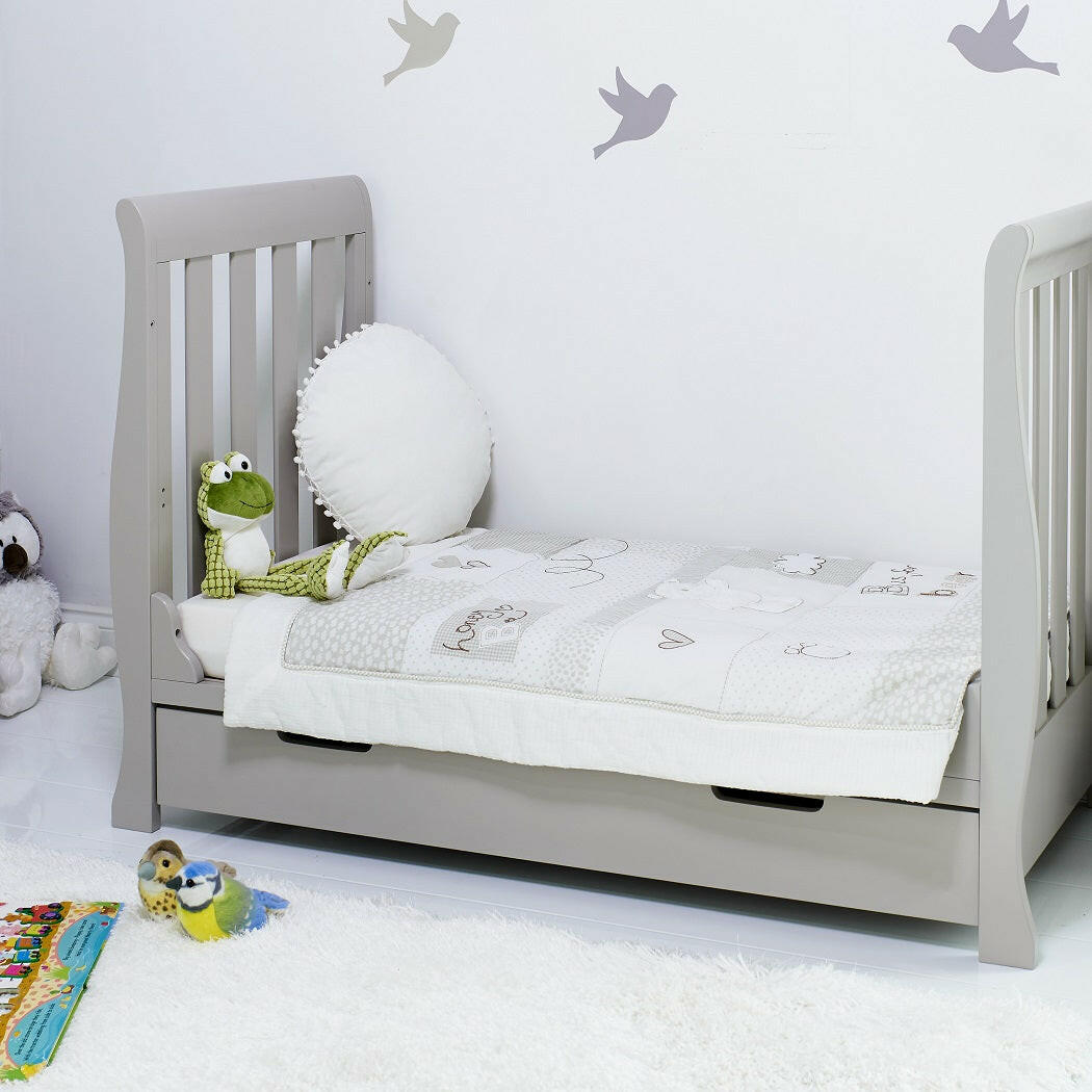 Obaby Stamford Mini Sleigh Cot Bed with SPRUNG Mattress (Warm Grey) - lifestyle image of the junior bed (bedding and toys not included)