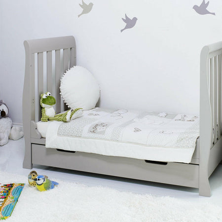 Obaby Stamford Mini Sleigh Cot Bed with SPRUNG Mattress (Warm Grey) - lifestyle image of the junior bed (bedding and toys not included)
