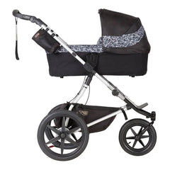 Mountain Buggy v3.2 Carrycot Plus (Graphite) - side view, shown here as the carrycot fitted onto a chassis (chassis/buggy not included, available separately)