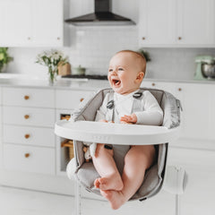 BEABA Up & Down Evolutive Highchair (White) - lifestyle image, shown here with an infant/toddler cushion (not included, available separately)